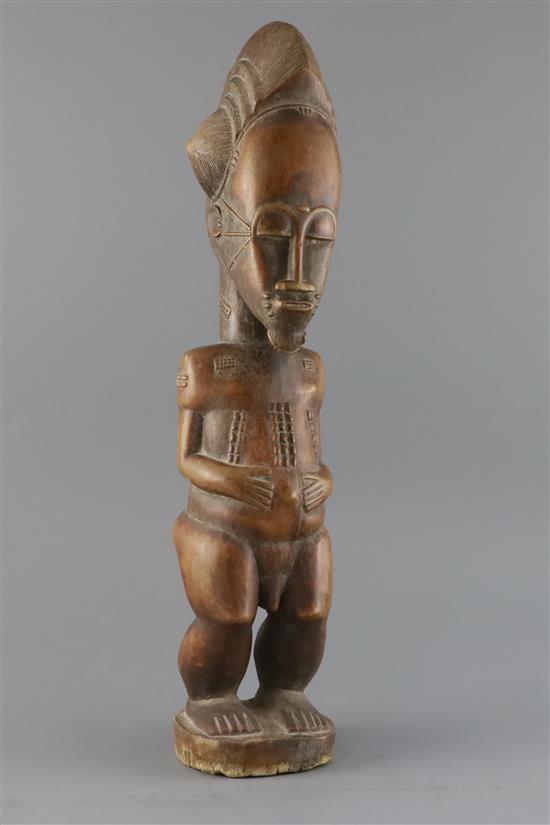 A West African tribal fertility figure, H.18.75in.